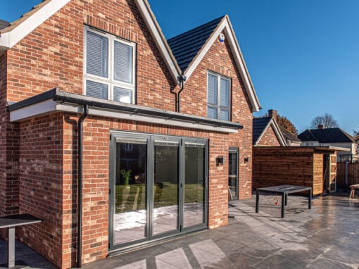 uPVC flush sash windows and anthracite aluminium front door on a purpose-built new-build on the outskirts of Colchester