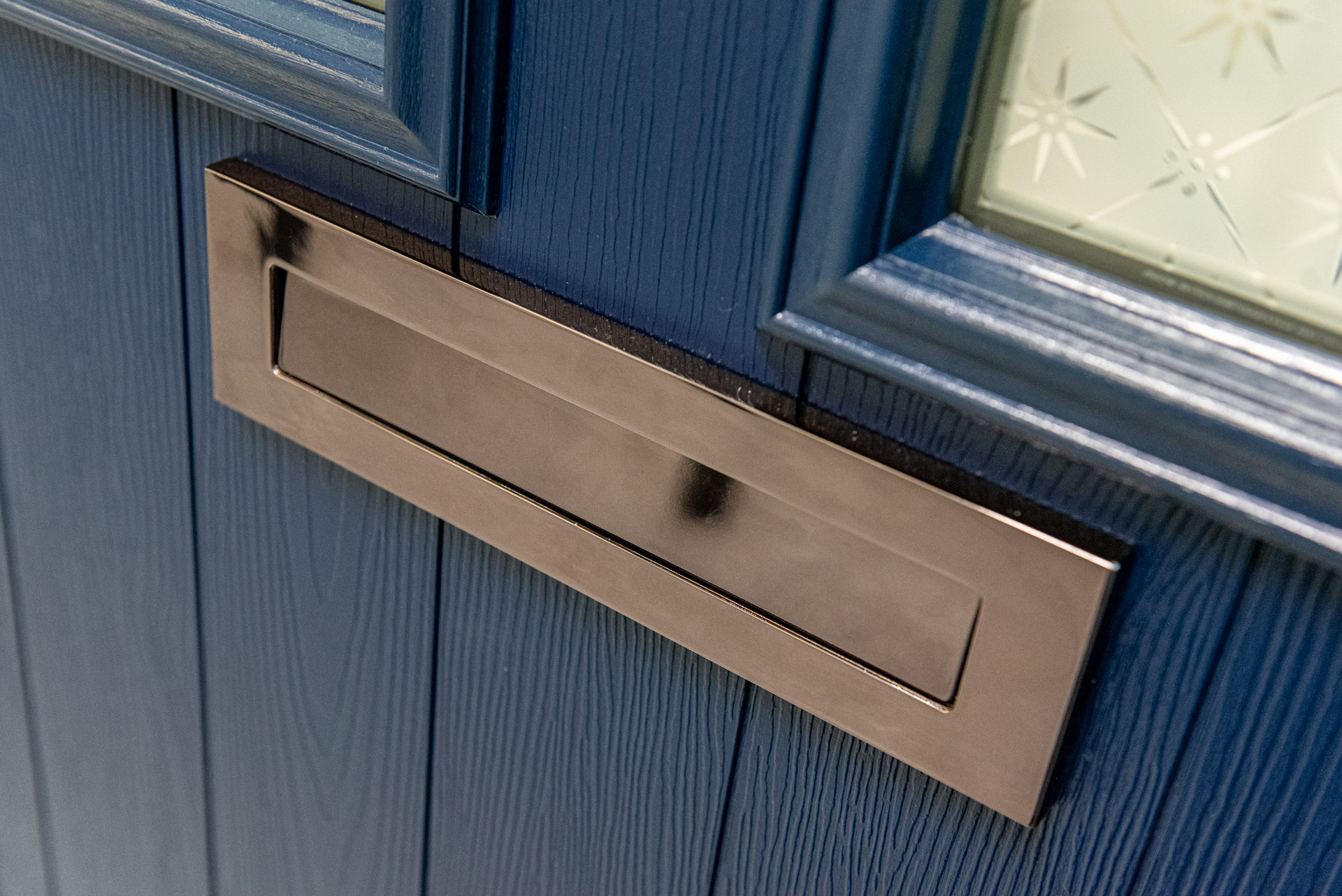 Blue Comp Door composite front door with a polished chrome letterplate